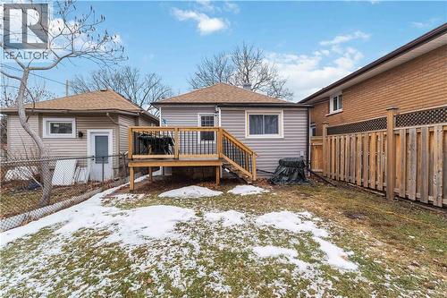 Rear exterior with a wood deck featuring black metal railings - 74 Province Street N, Hamilton, ON - Outdoor With Deck Patio Veranda With Exterior