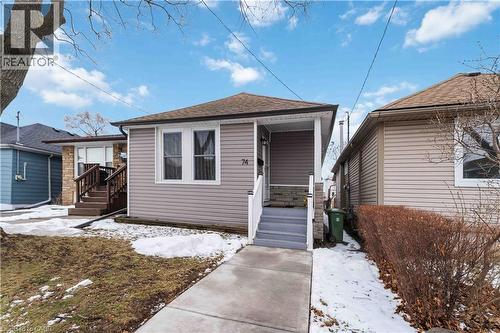 Single-story residence featuring light gray siding with white trim - 74 Province Street N, Hamilton, ON - Outdoor