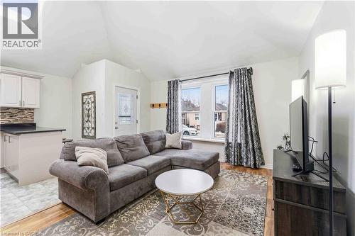Open-concept living area with vaulted ceiling and visible skylight - 74 Province Street N, Hamilton, ON - Indoor Photo Showing Living Room