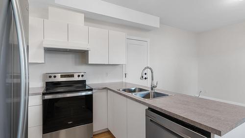2140 Montenegro Drive, Kelowna, BC - Indoor Photo Showing Kitchen With Double Sink