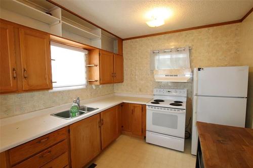 Eat In Style Kitchen - 313 Patrick Avenue, The Pas, MB - Indoor Photo Showing Kitchen With Double Sink