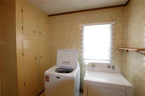 Laundry in Kitchen - 313 Patrick Avenue, The Pas, MB - Indoor Photo Showing Laundry Room