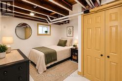 virtually staged basement bedroom - 