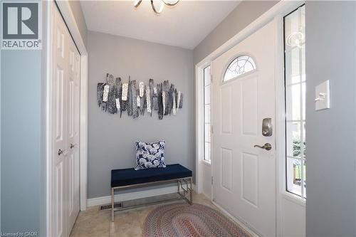 Entryway featuring a white paneled door with an arched decorative glass insert and sidelights - 70 Queen Charlotte Crescent, Kitchener, ON - Indoor Photo Showing Other Room