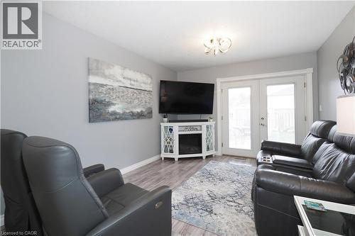 Living area featuring wood-finish flooring, light gray wall paint, and white trim - 70 Queen Charlotte Crescent, Kitchener, ON - Indoor Photo Showing Living Room