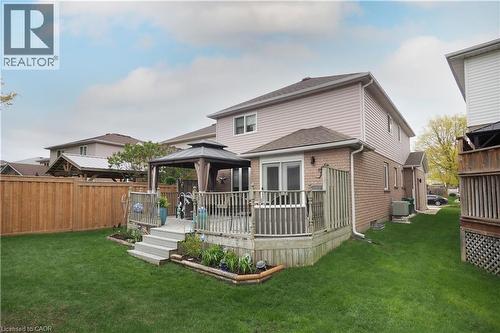 Expansive backyard featuring a multi-level wood deck, a built-in gazebo, and a manicured lawn - 70 Queen Charlotte Crescent, Kitchener, ON - Outdoor With Deck Patio Veranda