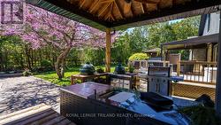 Covered area with an outdoor kitchen. - 