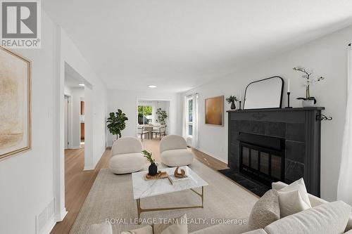 This living room has been virtually staged. - 93 Hewitt Way, Ottawa, ON - Indoor Photo Showing Living Room With Fireplace