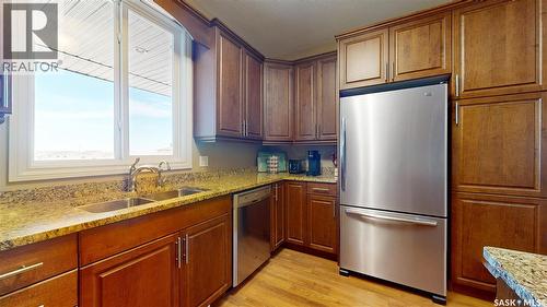 302 3750 Haughton Road E, Regina, SK - Indoor Photo Showing Kitchen With Double Sink