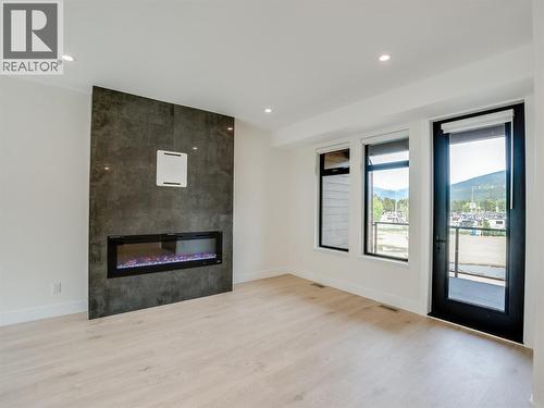 910 Lakeside Drive Unit# 203, Nelson, BC - Indoor Photo Showing Living Room With Fireplace
