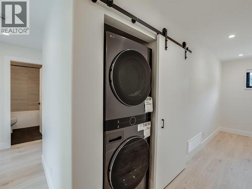 Stacked laundry - 910 Lakeside Drive Unit# 203, Nelson, BC - Indoor Photo Showing Laundry Room