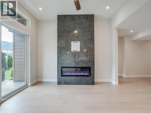 910 Lakeside Drive Unit# 403, Nelson, BC - Indoor Photo Showing Other Room With Fireplace