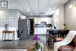 Main Floor Unit / Living Room To Dining Area - 