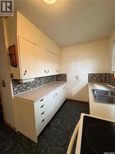 209 2Nd Avenue E, Kelvington, SK - Indoor Photo Showing Kitchen With Double Sink