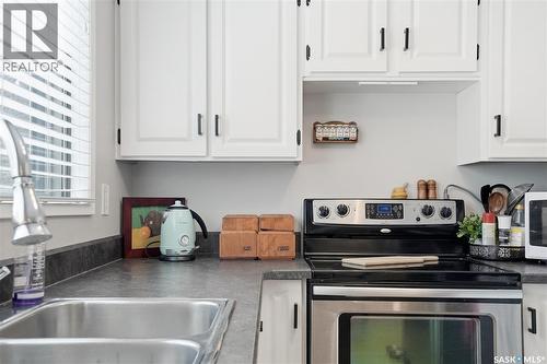 16 425 Pinehouse Drive, Saskatoon, SK - Indoor Photo Showing Kitchen With Double Sink