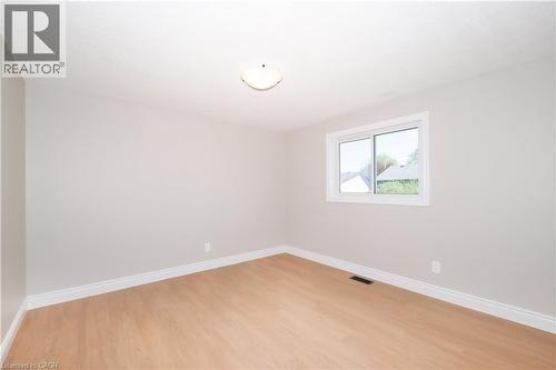 Neutral-toned walls complement wood-finish flooring - 27 Scenic Wood Crescent, Kitchener, ON - Indoor Photo Showing Other Room