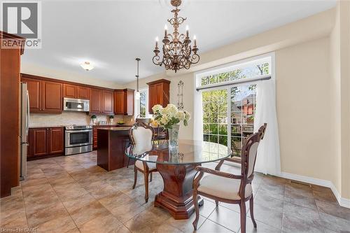 spacious dinette area walk out patio door to backyard oasis - 16 Westridge Drive, Hamilton, ON - Indoor Photo Showing Dining Room