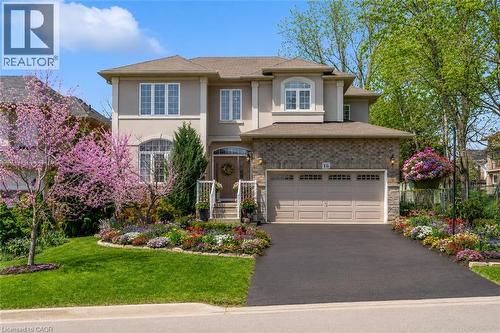 Luxury detached house with stucco, brick, beautiful landscaped yard (with virtual edited spring flower) - 16 Westridge Drive, Hamilton, ON - Outdoor With Facade