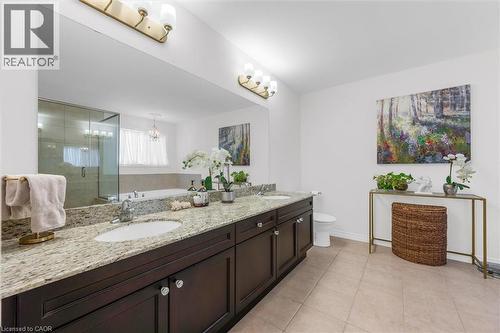 Dual vanity featuring granite countertops, undermount sinks - 16 Westridge Drive, Hamilton, ON - Indoor Photo Showing Bathroom