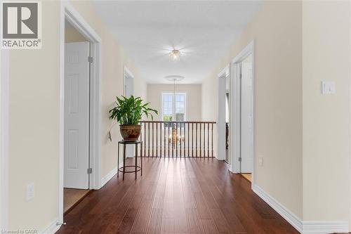 Upper level hallway featuring anti slippery engineered flooring, light-toned walls, and white trim - 16 Westridge Drive, Hamilton, ON - Indoor Photo Showing Other Room