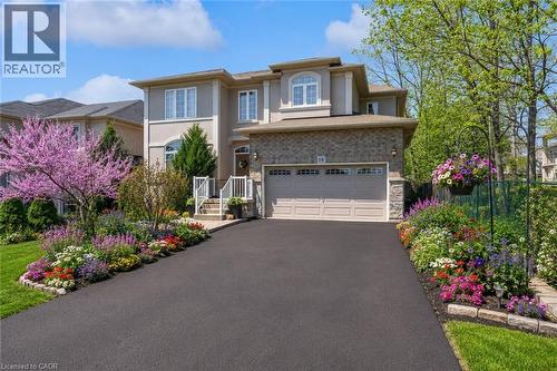 Luxury detached house with stucco, brick, beautiful landscaped yard (with virtual edited spring flower) - 16 Westridge Drive, Hamilton, ON - Outdoor With Facade