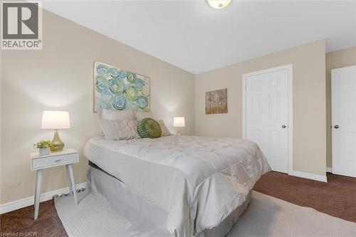 2nd bedroom, upgraded stain-resistant carpet (2019), a closet and multiple large windows - 16 Westridge Drive, Hamilton, ON - Indoor Photo Showing Bedroom