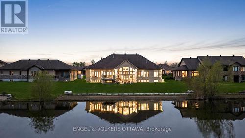 Lawn has been digitally enhanced - 1457 Waters Edge Way, Ottawa, ON - Outdoor With Body Of Water