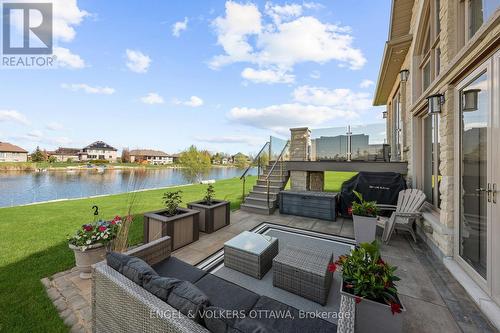 Walk Out Lower Level Patio From Stair Landing - 1457 Waters Edge Way, Ottawa, ON - Outdoor With Body Of Water With Deck Patio Veranda