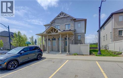 Stone and siding exterior with gabled portico entries - 388 Old Huron Road Unit# 24A, Kitchener, ON - Outdoor