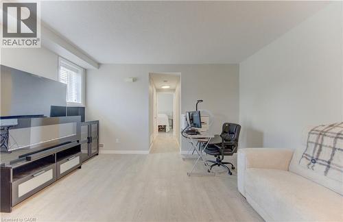 Spacious room featuring light-toned flooring, white walls, and a window with blinds - 388 Old Huron Road Unit# 24A, Kitchener, ON - Indoor