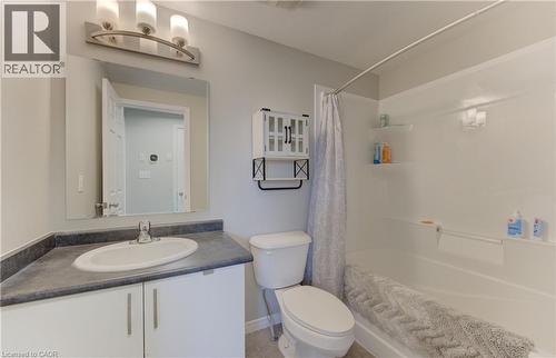 Bathroom featuring a single vanity with gray countertop, white cabinetry, and an oval undermount sink - 388 Old Huron Road Unit# 24A, Kitchener, ON - Indoor Photo Showing Bathroom