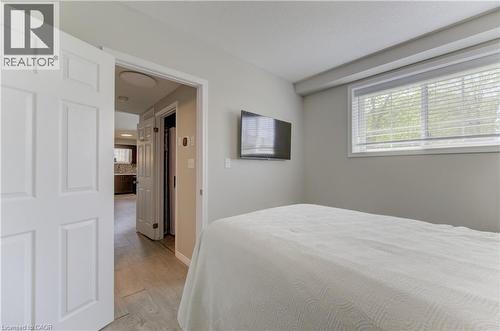 Bright room with light gray walls and a window featuring white blinds - 388 Old Huron Road Unit# 24A, Kitchener, ON - Indoor Photo Showing Bedroom