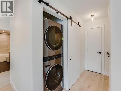 Stacked laundry - 910 Lakeside Drive Unit# 208, Nelson, BC - Indoor Photo Showing Laundry Room
