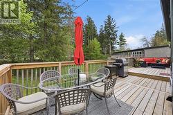 Multi-level wood deck featuring a railing system - 