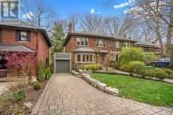 63 BEAUFORT ROAD Toronto, ON M4E 1M8