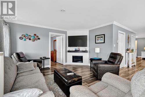 ground level in-law suite - 46 Remembrance Loop, Carbonear, NL - Indoor Photo Showing Living Room With Fireplace