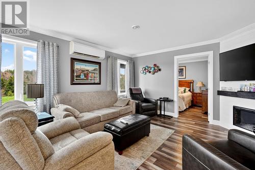 ground level in-law suite - 46 Remembrance Loop, Carbonear, NL - Indoor Photo Showing Living Room With Fireplace