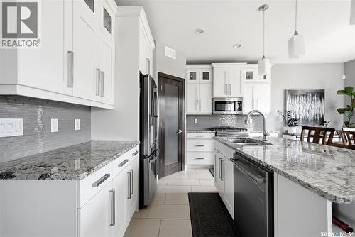 3930 Sandhill Crescent, Regina, SK - Indoor Photo Showing Kitchen With Stainless Steel Kitchen With Double Sink With Upgraded Kitchen