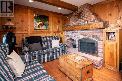 Family room with Brick Fireplace - 294 Everett Drive, Parry Sound Remote Area (Restoule), ON - Indoor Photo Showing Living Room With Fireplace