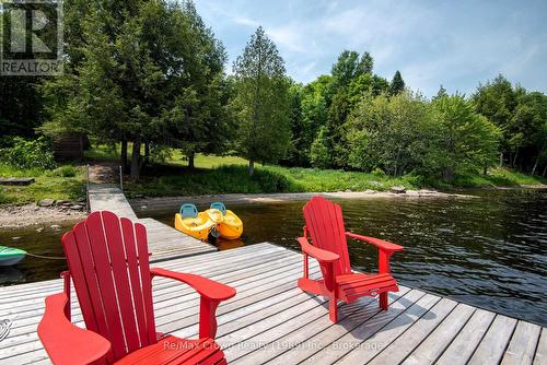 Relaxing on the Dock - 294 Everett Drive, Parry Sound Remote Area (Restoule), ON - Outdoor With Deck Patio Veranda