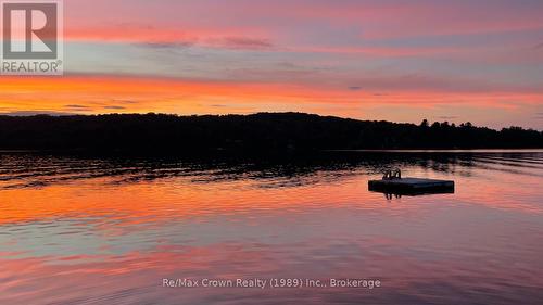 Beautiful sunsent standing on Dock - 294 Everett Drive, Parry Sound Remote Area (Restoule), ON - Outdoor With Body Of Water With View