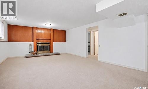 314 Waterbury Road E, Saskatoon, SK - Indoor Photo Showing Other Room With Fireplace