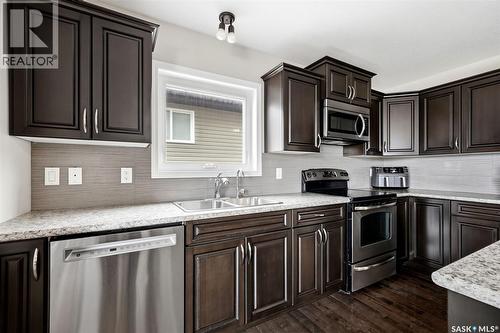 5038 Anthony Way, Regina, SK - Indoor Photo Showing Kitchen With Double Sink With Upgraded Kitchen