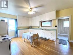 Farmhouse - Eat-in Kitchen with original hardwood floors - 