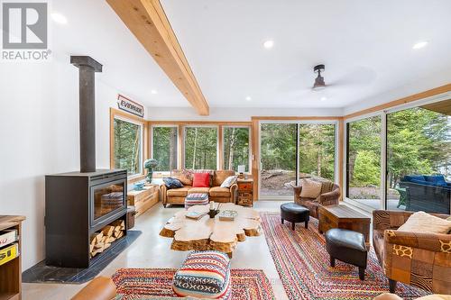 13 Labrash Lake Road, Whitestone, ON - Indoor Photo Showing Living Room With Fireplace