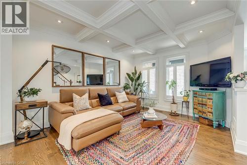 Living room with light wood-style floors, coffered ceiling, recessed lighting, and crown molding - 3311 Springvale Court, Burlington, ON - Indoor Photo Showing Living Room