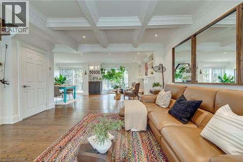 Living room with wood finished floors, coffered ceiling, recessed lighting, and ornamental molding - 3311 Springvale Court, Burlington, ON - Indoor Photo Showing Living Room