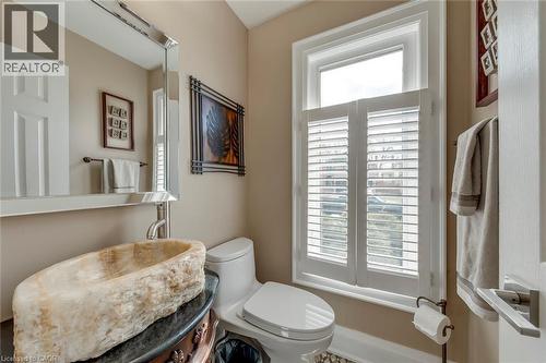 Half bath featuring toilet and a sink - 3311 Springvale Court, Burlington, ON - Indoor Photo Showing Bathroom