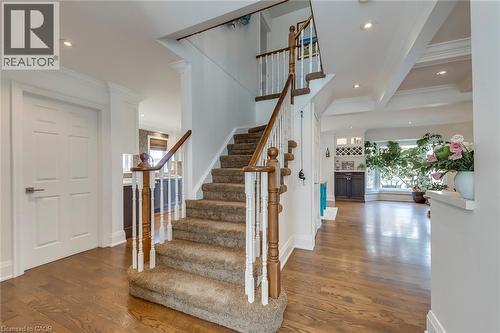 Stairs featuring wood finished floors, ornamental molding, recessed lighting, and beamed ceiling - 3311 Springvale Court, Burlington, ON - Indoor Photo Showing Other Room