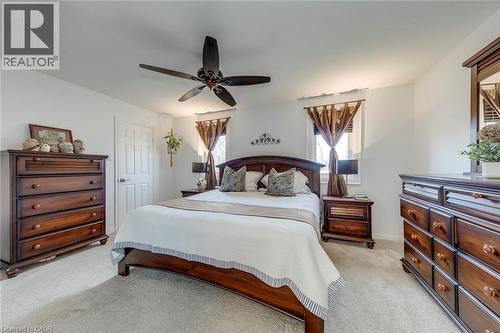 Bedroom with light carpet and ceiling fan - 3311 Springvale Court, Burlington, ON - Indoor Photo Showing Bedroom